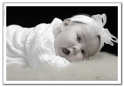 white baby sleeping in the bed