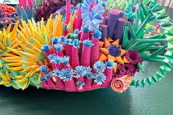 array of colorful, quilled elements resembling sea vegetation