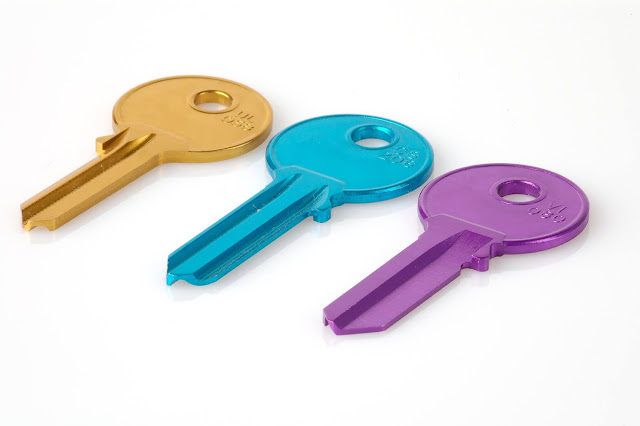 3 multi coloured keys on white background:Photo by Florian Berger on Unsplash