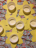 Cup cake cases glued to the centre of the yellow daffodil cut outs