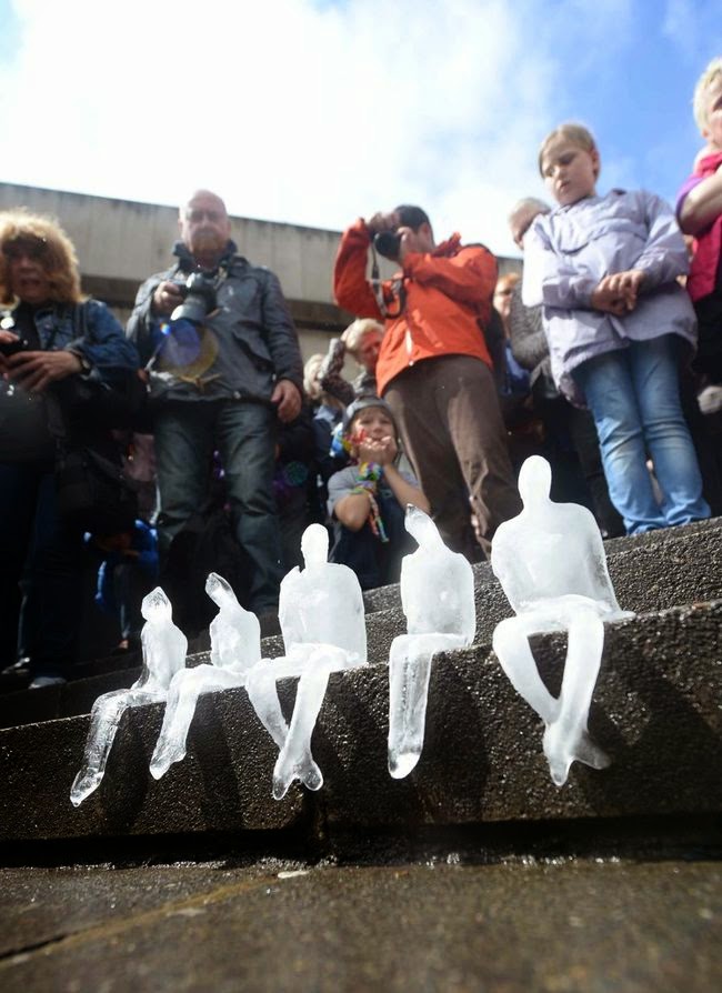 They solemnly looked on as they melted away in the sun. - To Commemorate WWI, This City Created A Powerful Temporary Ice Monument.