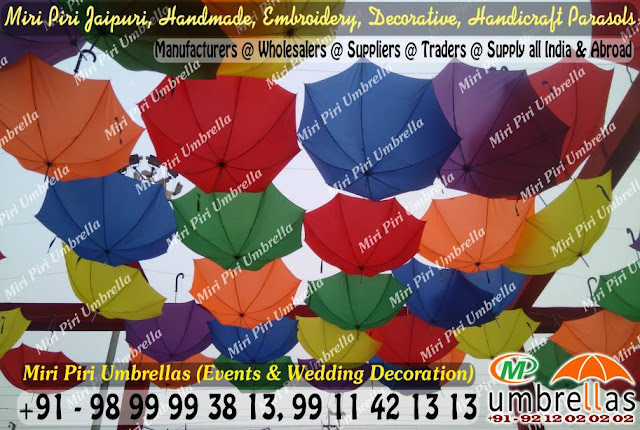 how to display a umbrella, how to display decorative umbrellas, how to display parasols, how to hang a parasol from a corner, how to hang a parasol from the ceiling, parasol decoration ideas, umbrella display images, how to hang umbrellas upside down, umbrella display rack stand, 