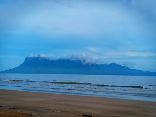 Spend a good few minutes looking at Mount Santubong view from the beach