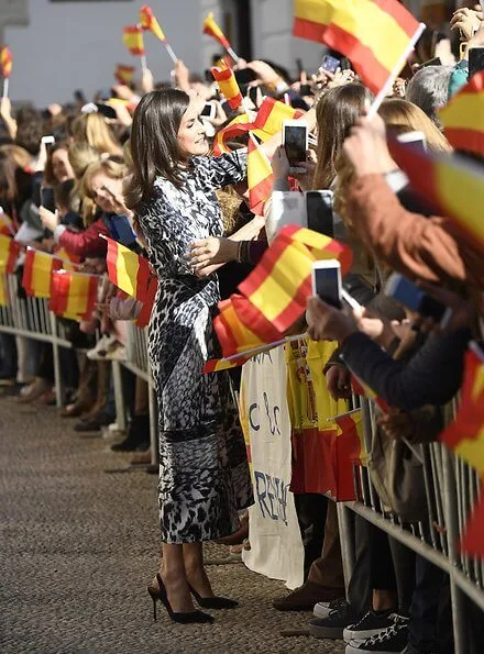 Queen Letizia wore a leopard-print silk blouse and midi skirt by Victoria Beckham. Carolina Herrera slingback black pumps