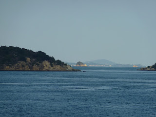 Islands in Seto inland sea taken from a ferry travelling from Naoshima (Miyanoura)  to Uno. Uno is in the background.