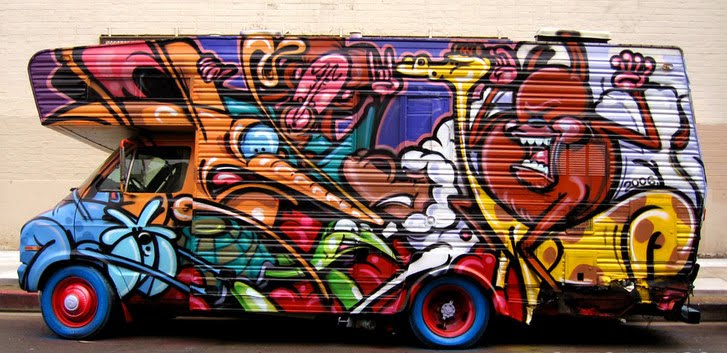 Graffiti cartoon character on the box car. Bright with colorful graffiti