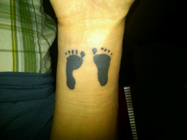baby footprints tattoo. aby footprint tattoos