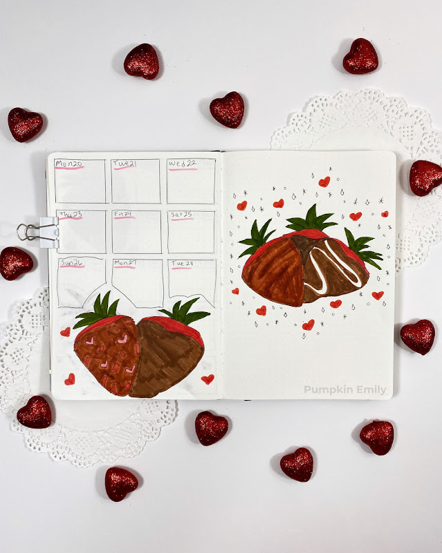 A one page bullet journal weekly spread with chocolate covered strawberries and another page with more strawberries.