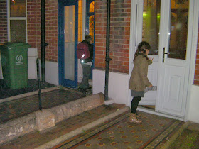 schoolchildren putting flyers through doors
