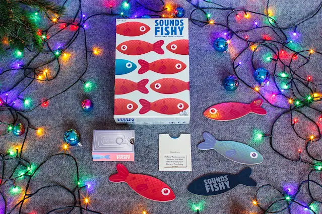 Sounds Fishy game with game pieces next to the box