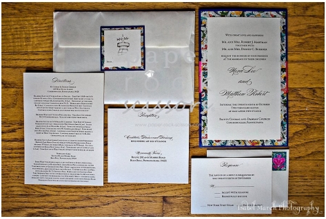 Cobalt provides a backdrop to this invitation while the coral ribbon and 