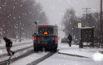 Riders disembark from Rogue Valley Transit’s Route 10 between Ashland and Medford, Oregon as snow begins accumulating Dec. 6, 2013. Animated gif superimposes snowfall effect.