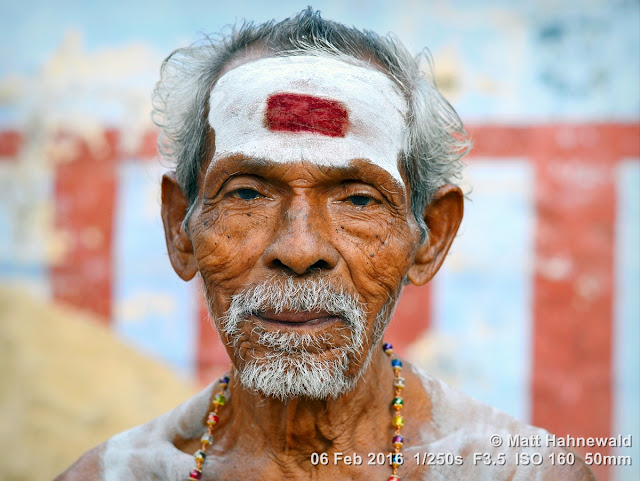 Matt Hahnewald Photography; Facing the World; closeup; street portrait; headshot; outdoor; Asia; South Asia; India; Tamil Nadu; Tiruchirappalli; Nikon D3100; Nikkor AF-S 50mm f/1.8G; travel; travel destination; Shaivite brahmin; old brahmin; Hindu; Hinduism; photography; colour; portraiture; person; people; eyes; grey hair; face; Srirangam; Sri Jambukeshwara Temple; eye contact; religion; vibhuti; white ash on forehead; third eye