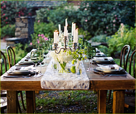 This farm table automatically says rustic It is set up to pull the greenery 