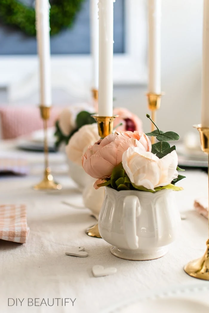 brass candlesticks, pink peonies and vintage ironstone