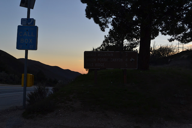 road sign and call box at Leona Divide Road