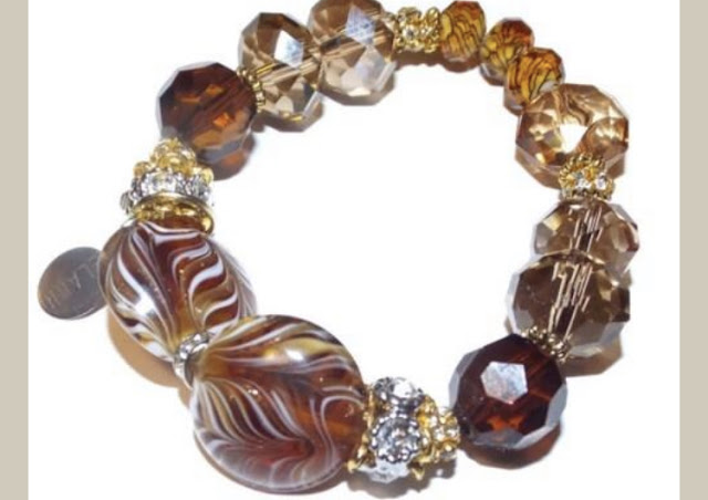 https://www.andreawagnerdesigns.com/products/beaded-bracelet-rondelle-crystal-beads-with-rhinestones-boho-chic-stretch-bracelet-the-amber-bracelet