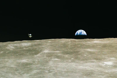 Lunar module and Earth.