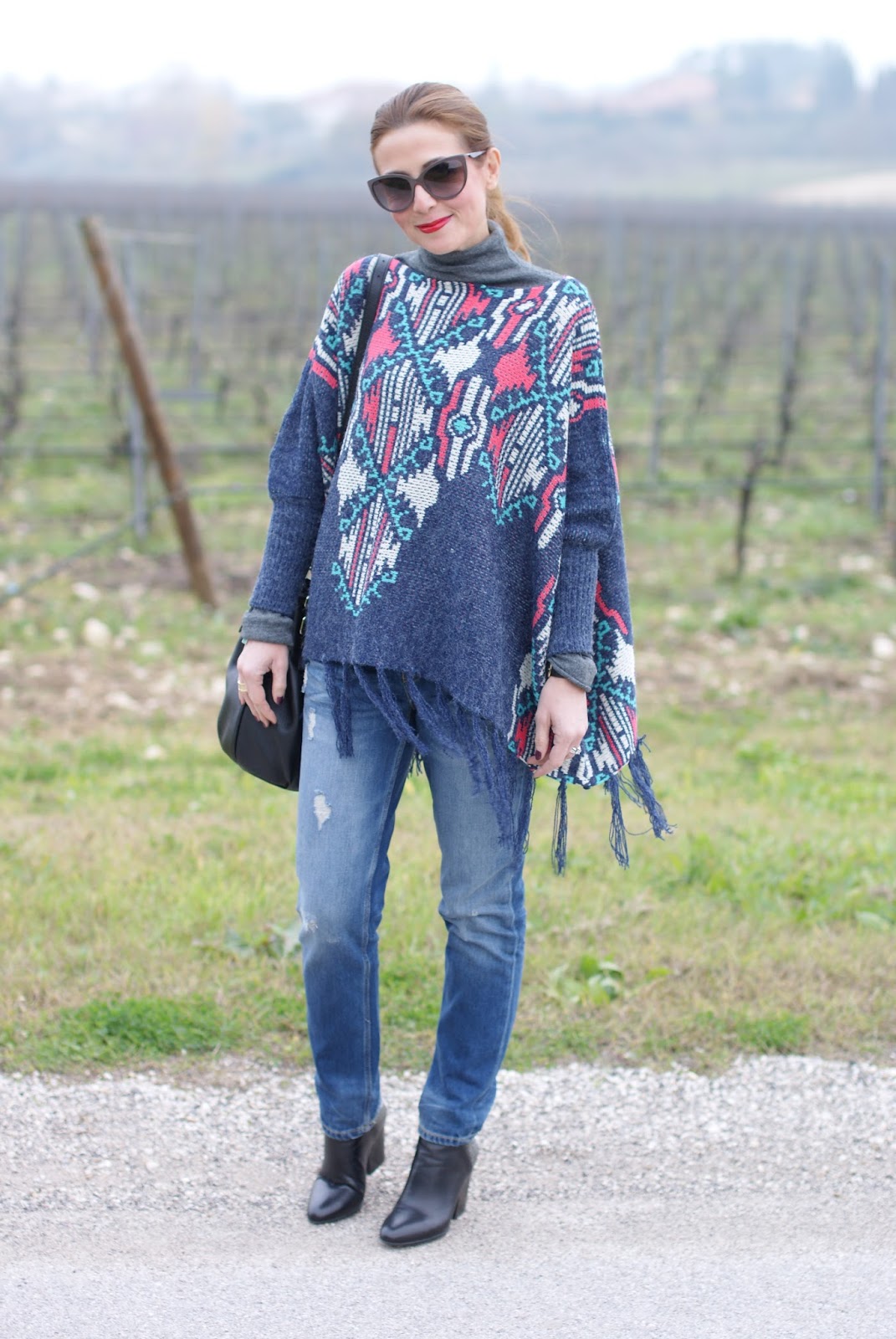 Fringed aztec poncho for a western inspired outfit on Fashion and Cookies fashion blog, fashion blogger style