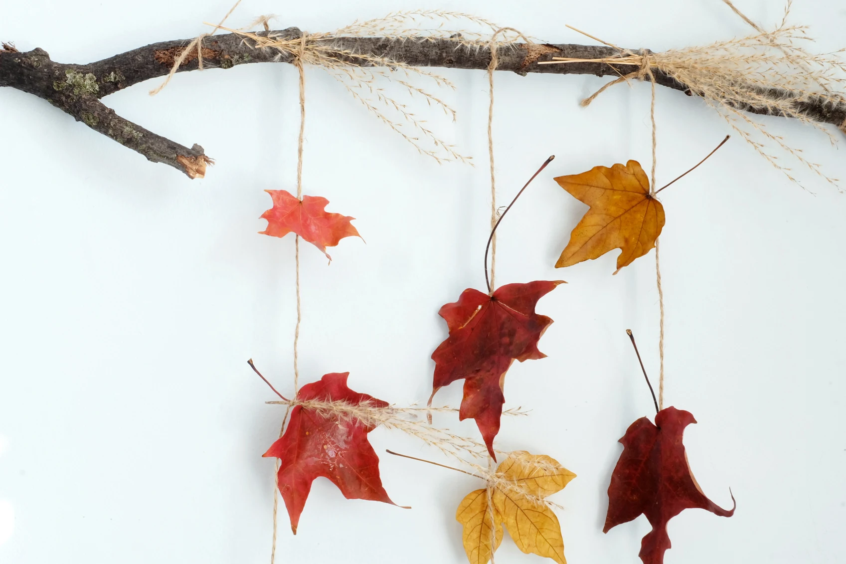 close up of fall leaf sun catcher wall hanging thingie