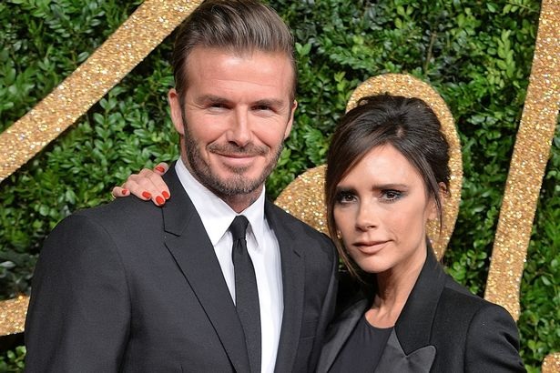 Victoria and David Beckham ring in the new year with a kiss amid rumours their marriage is in crisis