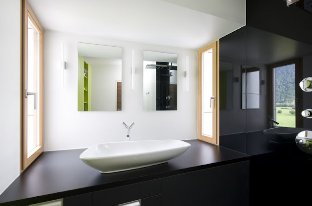 Sink near the White Tub in Home Bathroom with Wooden Floor