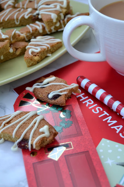 blondies with white chocolate chips and dried cranberries baked into crisp shards