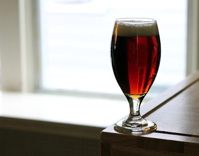 Glass of sour-cherry whisky-barrel-aged brown ale!