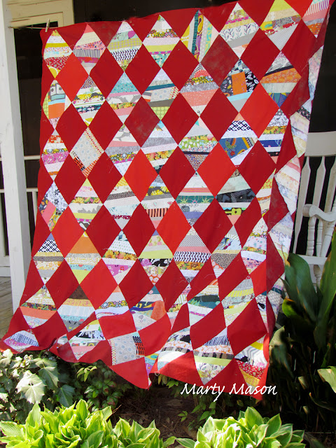 String quilt with shades of red - patchwork by Marty 