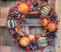 A wreath made of a variety of squash.