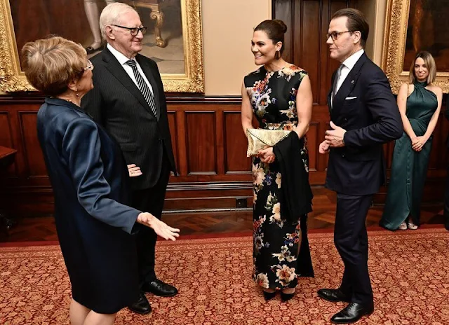Crown Princess Victoria wore a palm floral print silk maxi dress by Acne Studios. State governor Mrs. Margaret Beazley