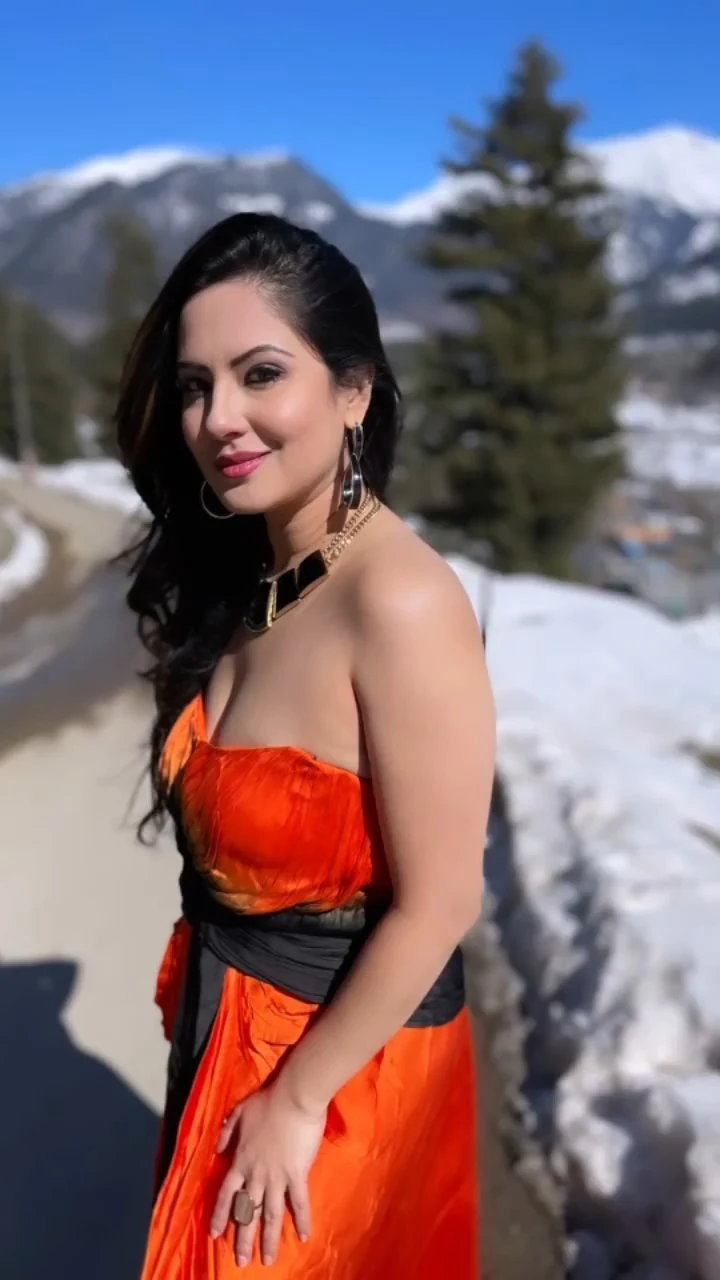 Puja Banerjee cleavage orange dress