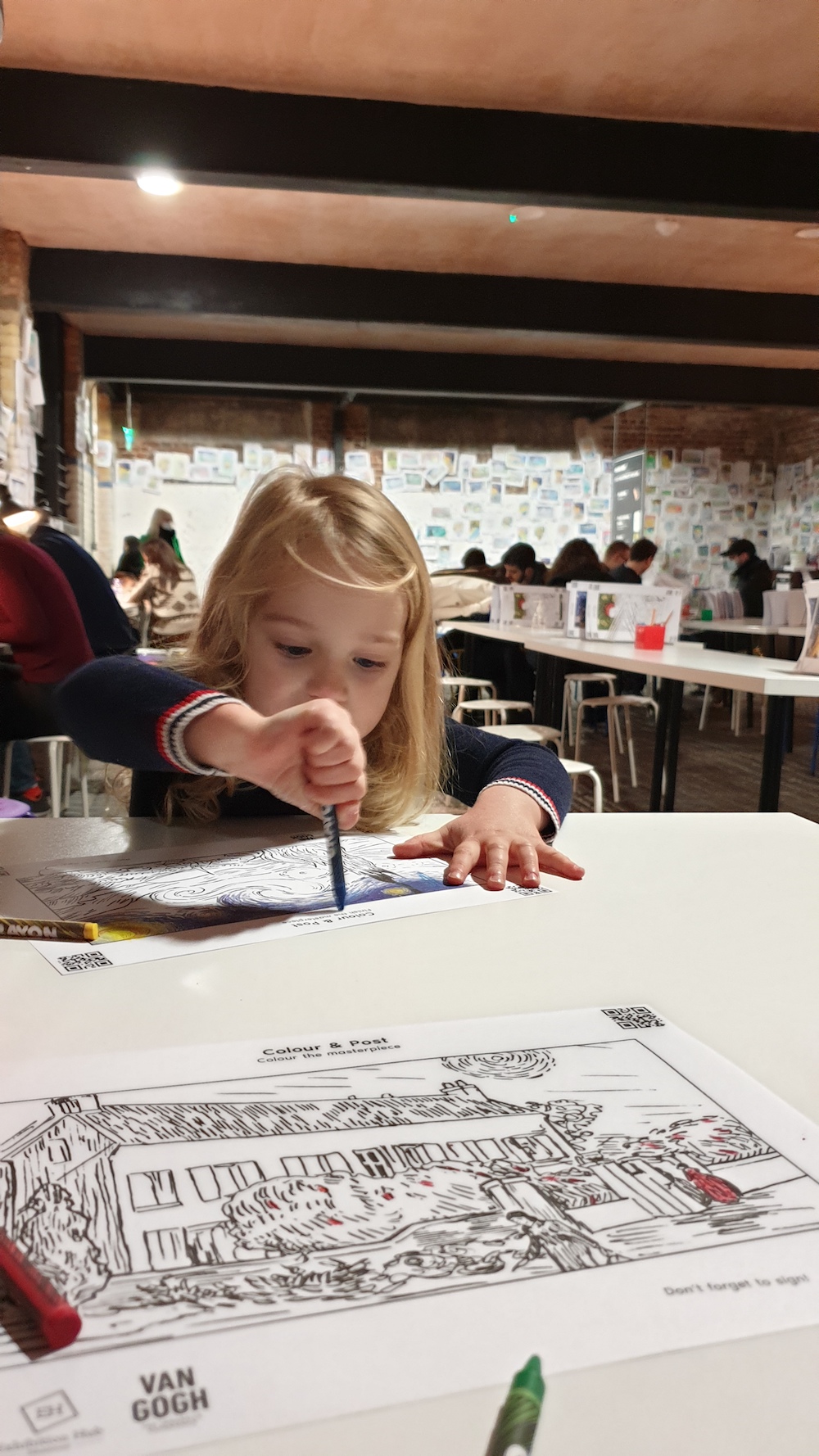 child colouring at van gogh experience
