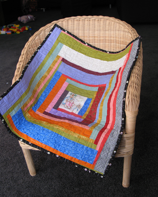 Log Cabin style Doll Quilt made entirely with scraps of fabric ~ Threading My Way