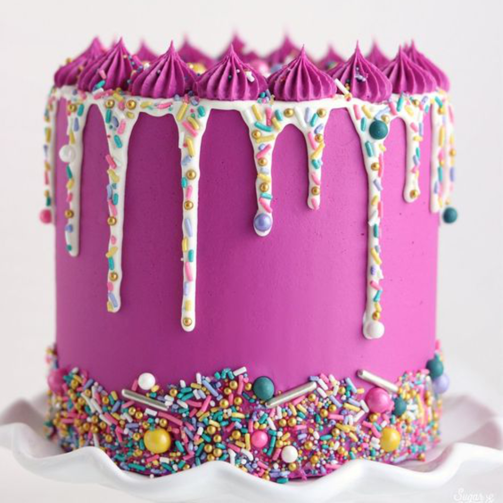 pink sprinkle drip cake