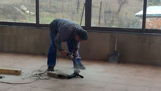 Bekir trimming a tile to size