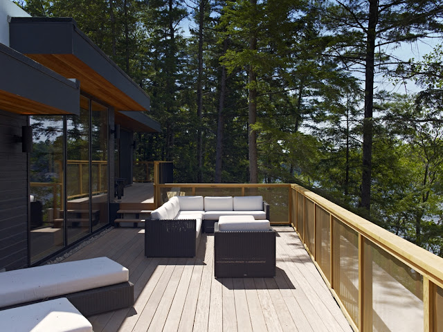 Photo of lovely open terrace with garden furniture up on the forest house
