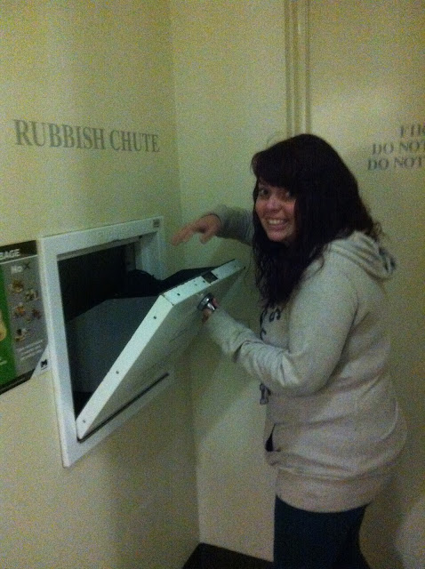 Amy using the rubbish chute