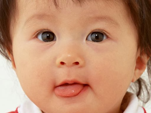 Sweet Cute Baby Showing Tongue Picture
