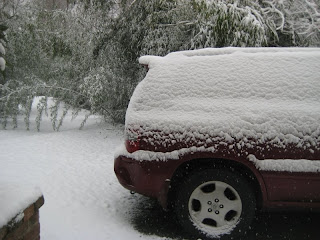 My car in the snow outside the Horace House