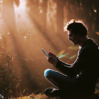 Create an image that shows a person using a technological device (such as a cell phone or computer) while sitting in a natural environment, such as a park or forest. In the image, highlight the idea that technology can connect us with the world in new ways, but that human experience is fundamental to understanding and appreciating the world around us. Use the hashtags #TechnologyAndHuman and #HumanExperience in the image to emphasize this message.