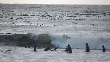 Whales beach in Kommetjie, Cape Town, South Africa.  About to get hit by a big wave.