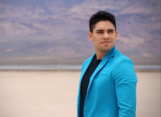 Marlon Medina looking away at the desert dry lake bed
