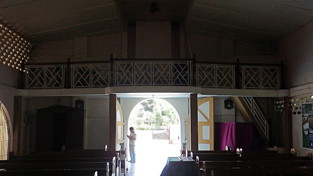 view of the main entrance and choir loft from inside the St. Paschal (San Pascual) Baylon parish church in Jiabong Samar