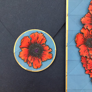 poppies envelope seal made from an extra red flower and blue background scraps. Memorial Day card.