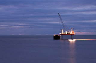Photograph of an Oil Rig Taken at Dusk