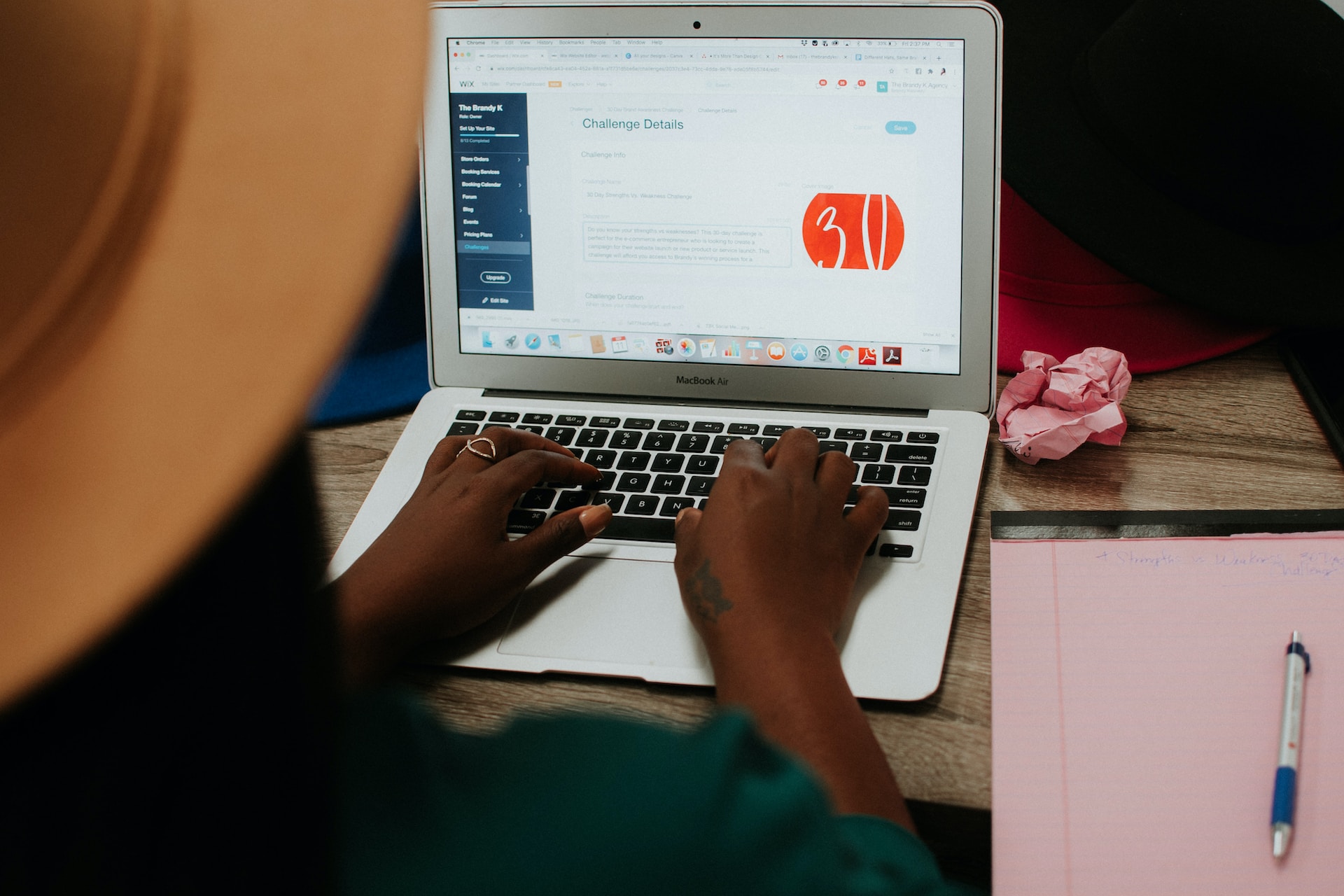 a woman in front of a laptop participating in a challenge