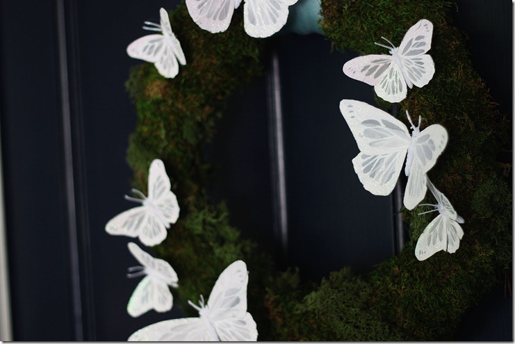 moss and butterfly wreath from the side