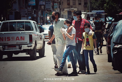 From Minya , Egyptian family wearing face masks