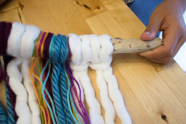 easy diy boho yarn wall hangings- super fun craft to make with the kids- all you need are sticks, yarn, and beads